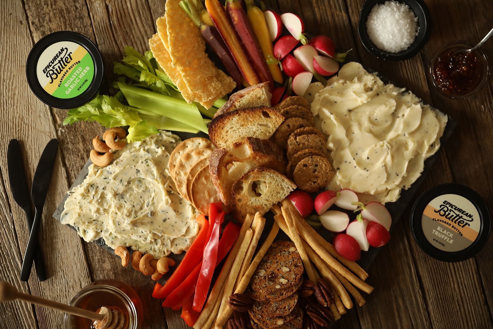 Butter board made with Epicurean Butter Roasted Garlic Herb and Black Truffle Flavored Butter