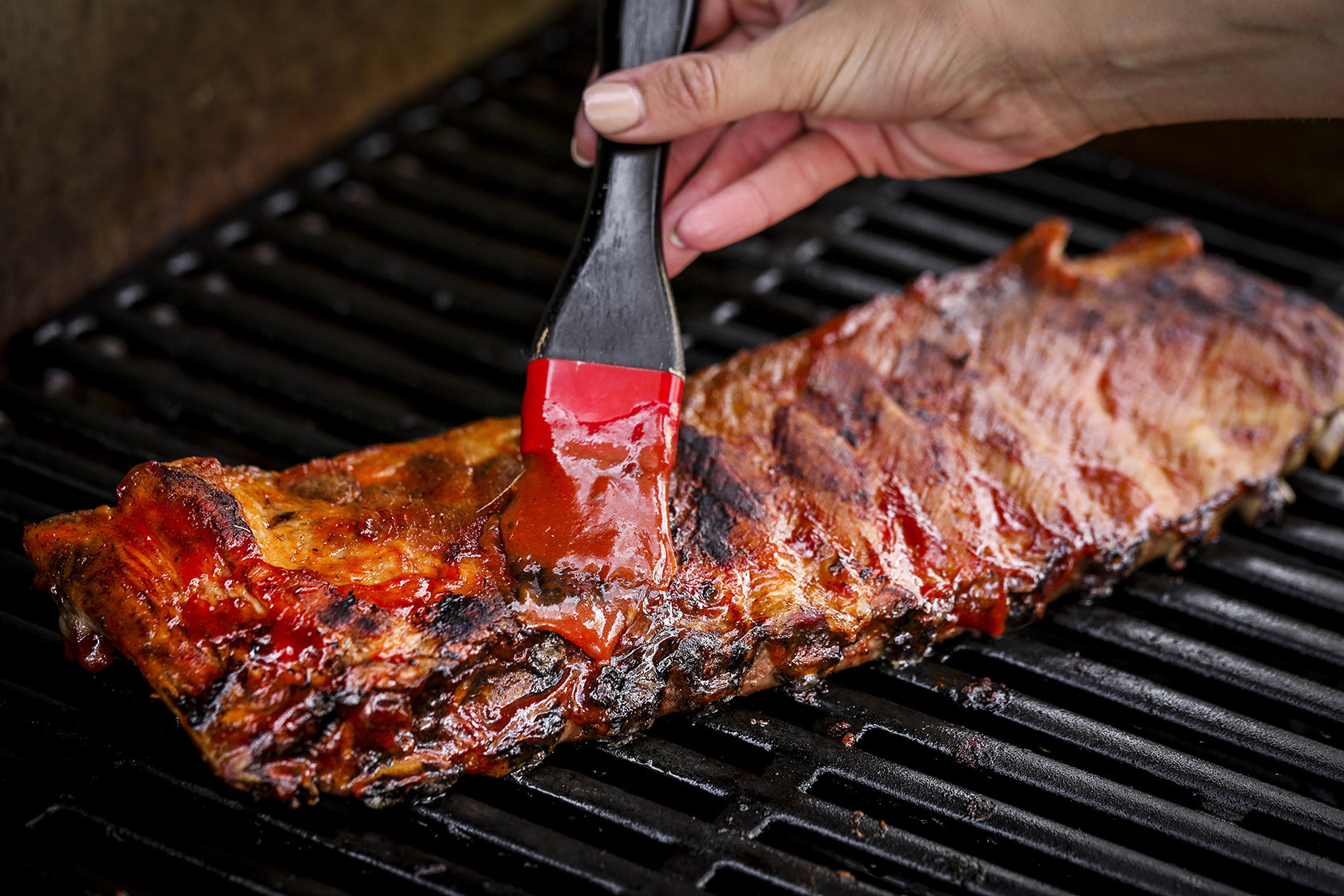 Ribs brushed with Roasted Garlic Herb BBQ Sauce