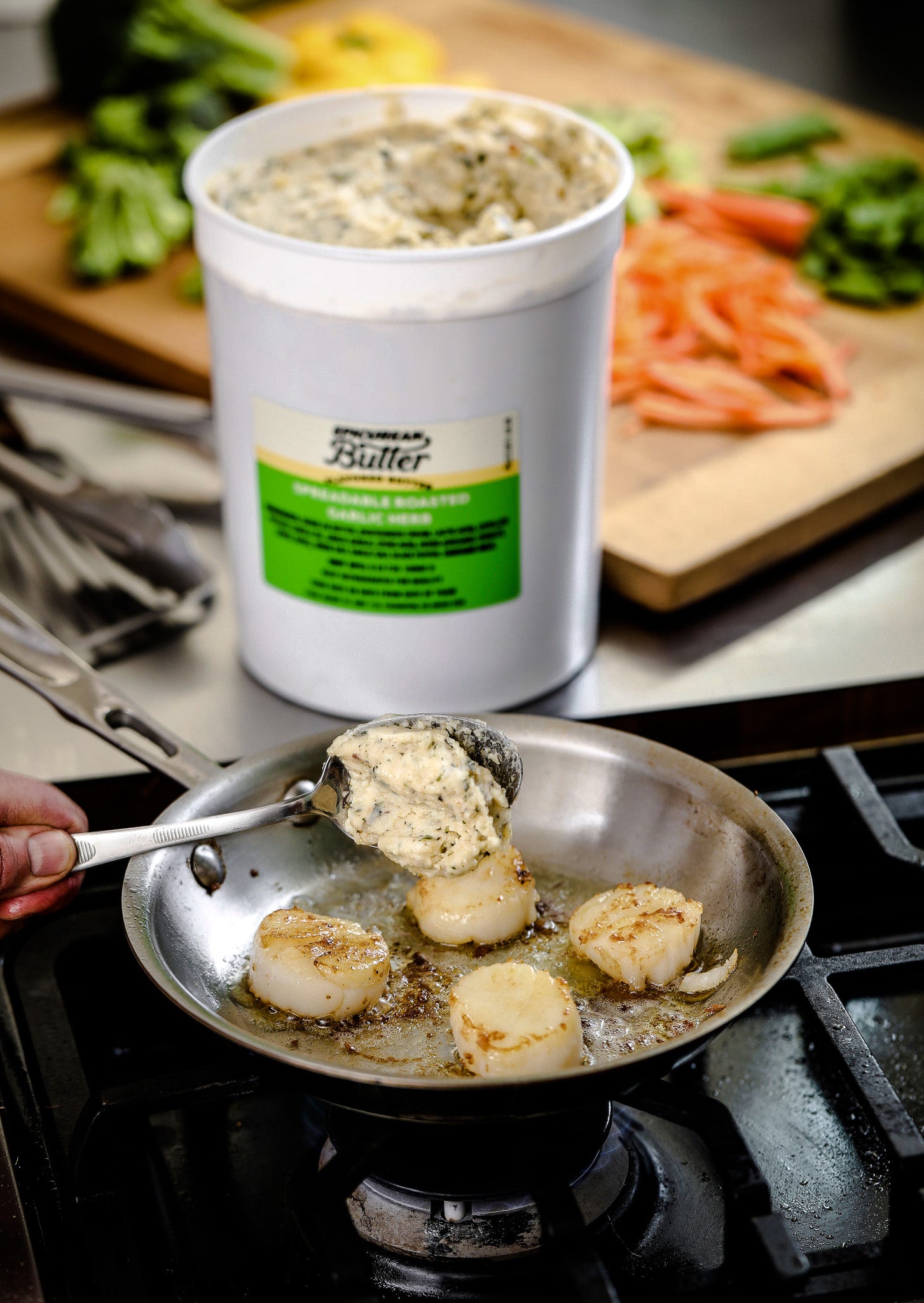 Chef cooking with 5 lb Epicurean Butter Roasted Garlic Herb Flavored Butter