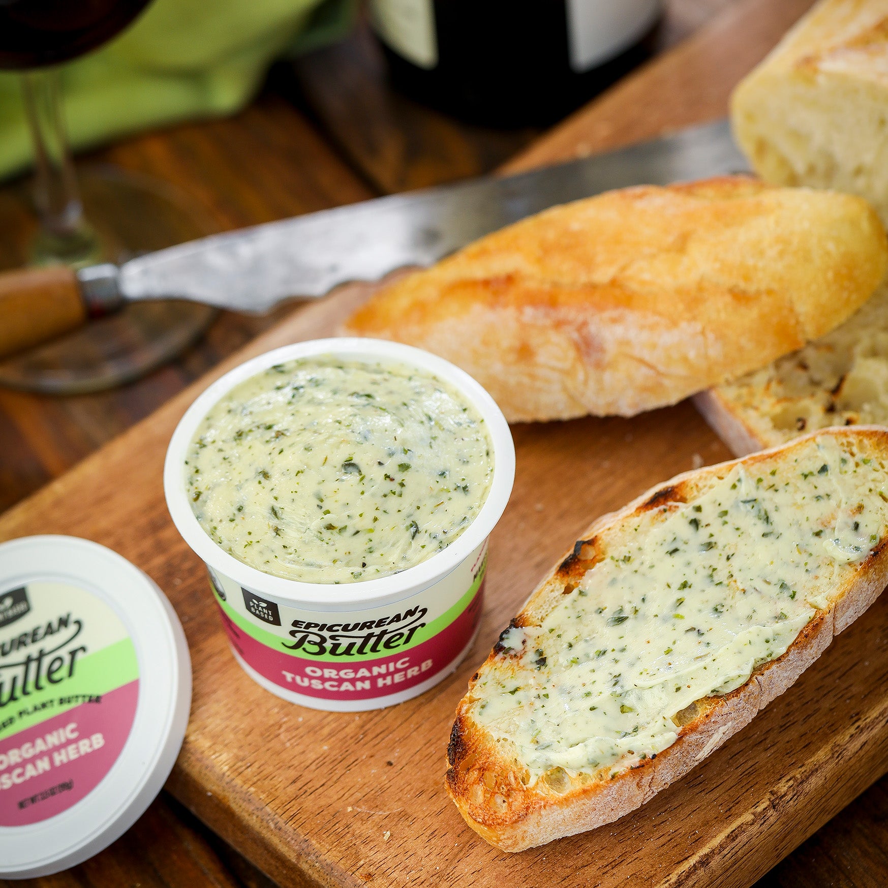 Organic Tuscan Herb Flavored Plant Butter with bread and wine
