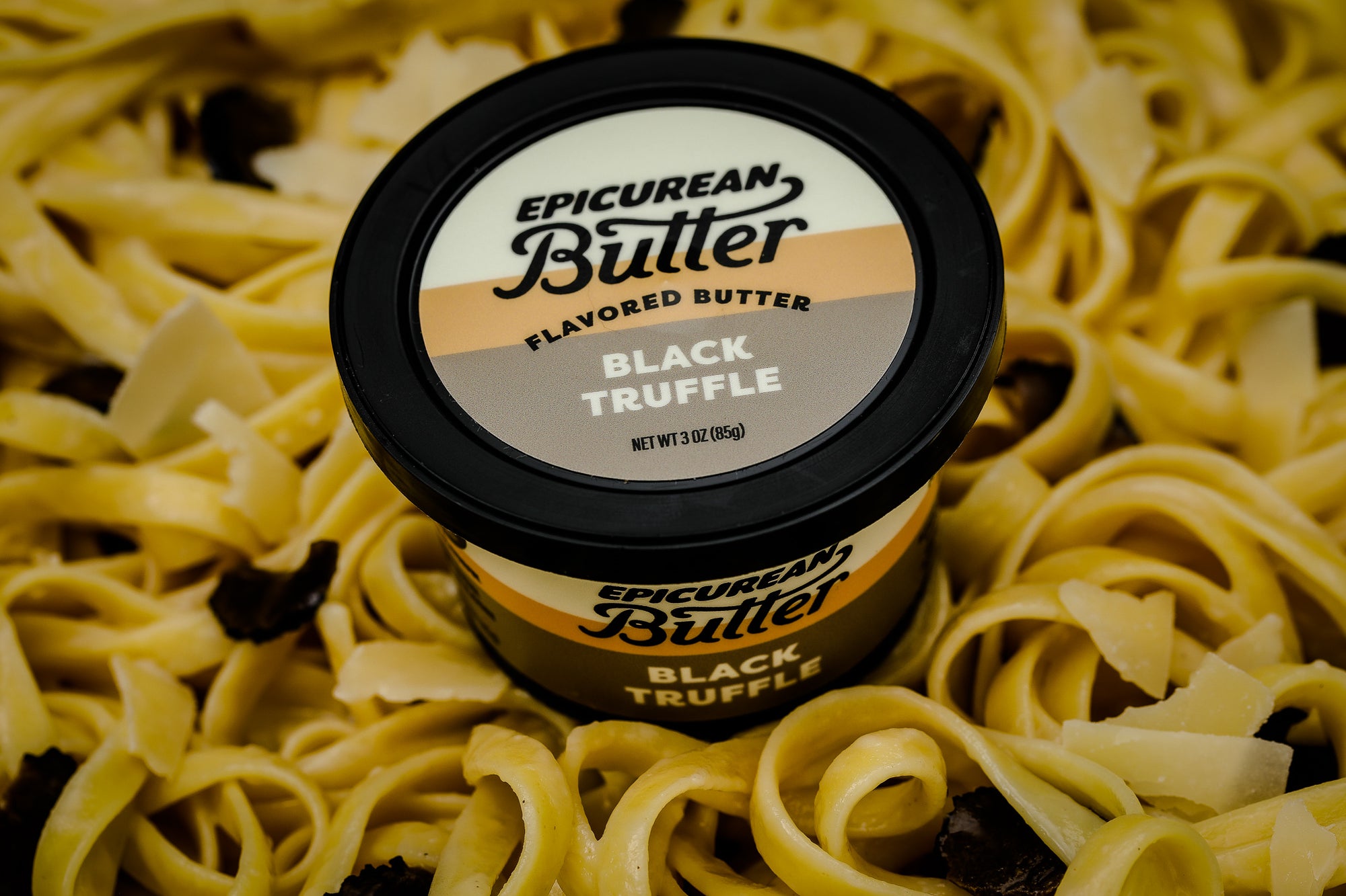 Epicurean Butter Black Truffle Flavored Butter with noodles and truffle pieces