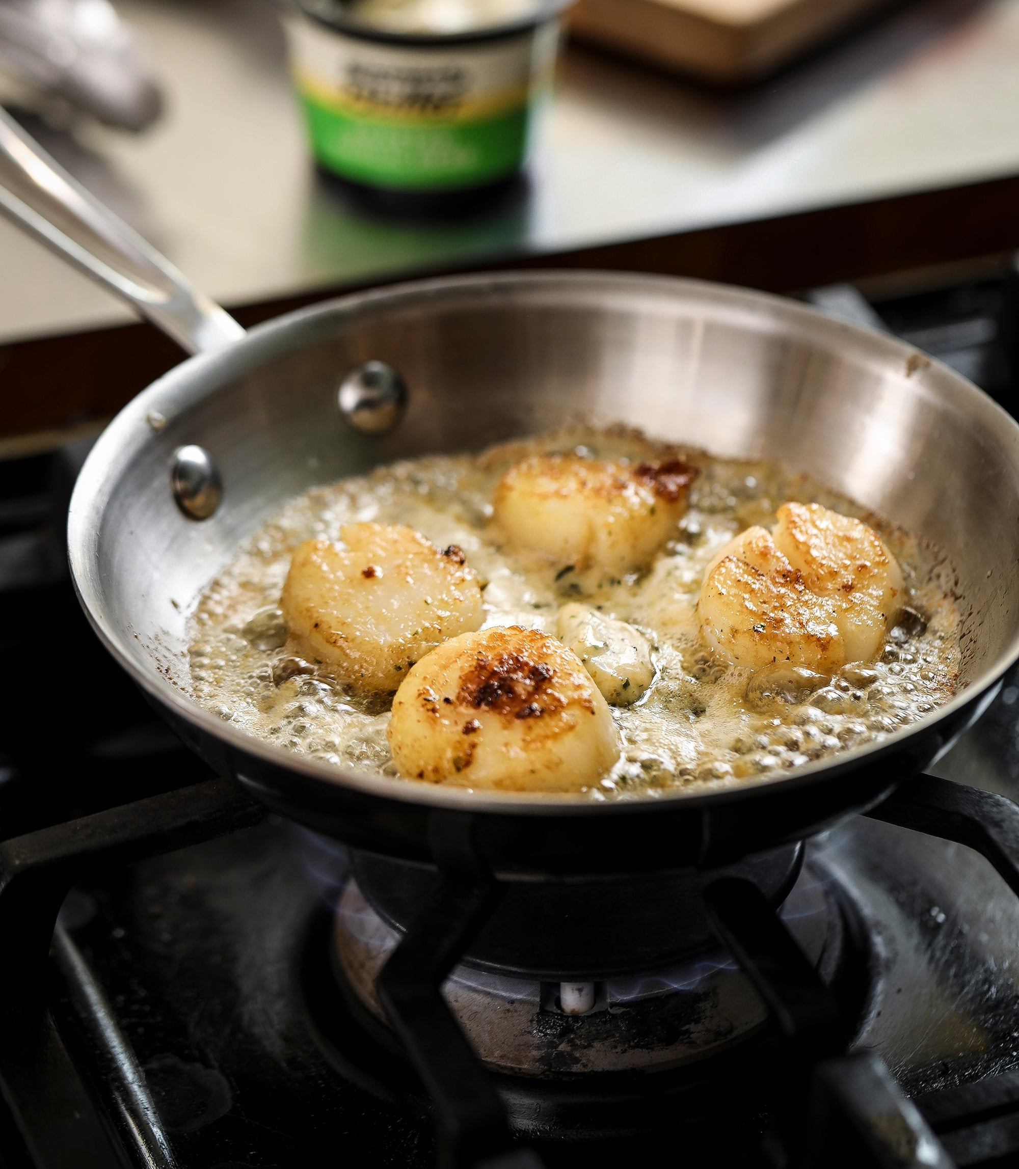 Scallops cooking in Epicurean Butter Roasted Garlic Herb Flavored Butter