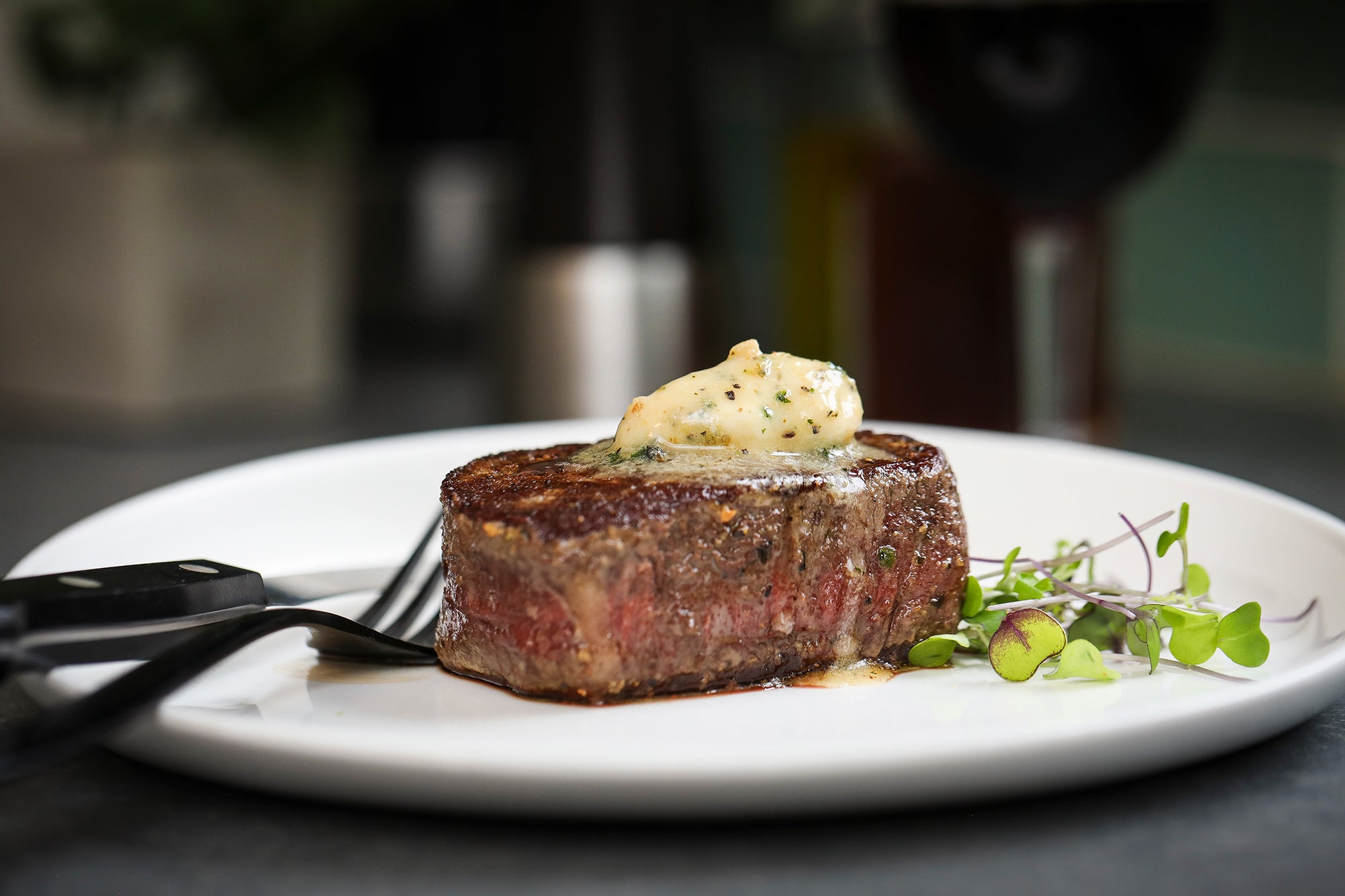 Steak with Epicurean Butter Roasted Garlic Herb Flavored Butter