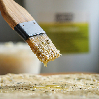 Garlic Parmesan Butter dripping from a Brush